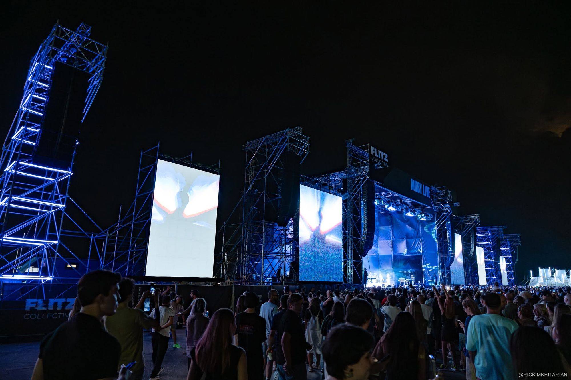 The screen and truss wall running down the side of the stage